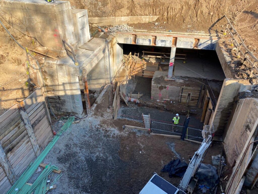Stone placement at the elevator and escalator foundations is now complete.