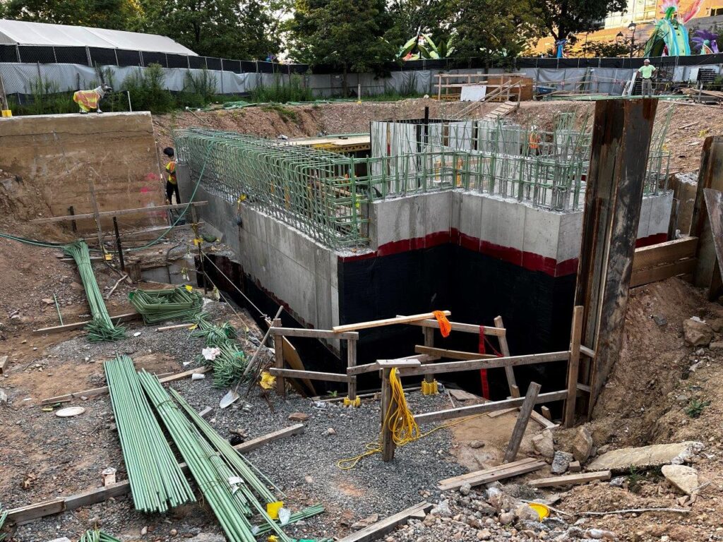 Backfilling along the Main Entrance north staircase foundation wall has progressed.