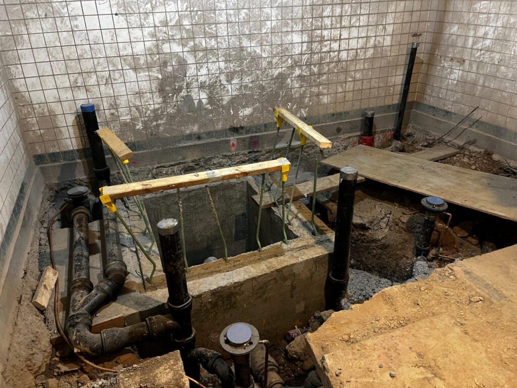 New station ejector pit concrete walls have been installed and plumbing is roughed-in.