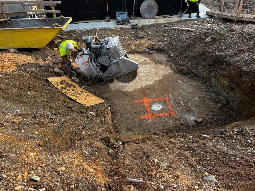 New south column location has been excavated in preparation for column installation.
