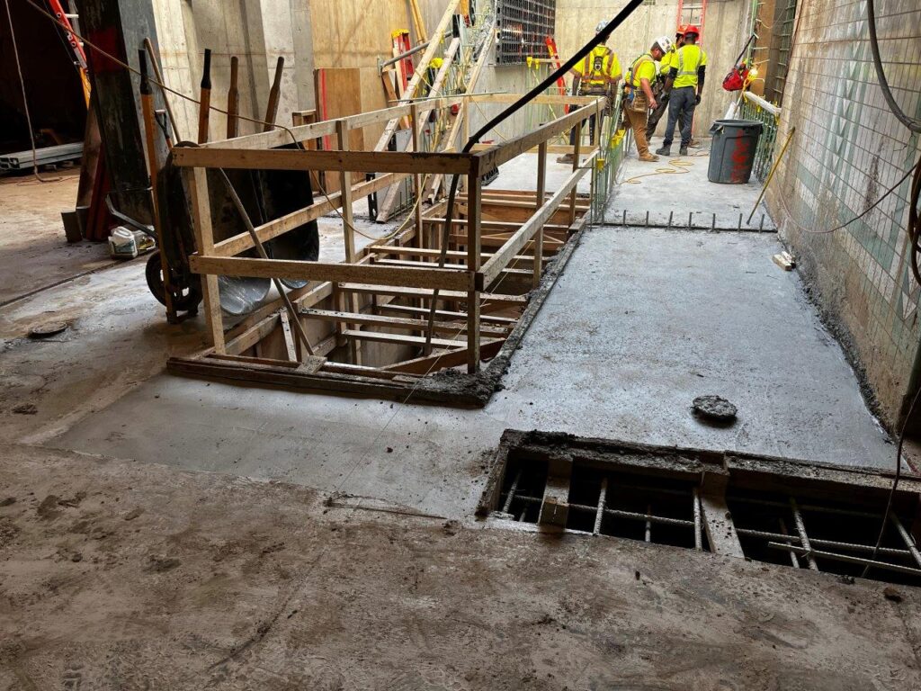 Concrete has been placed for the remaining portion of the staircase foundation slab.