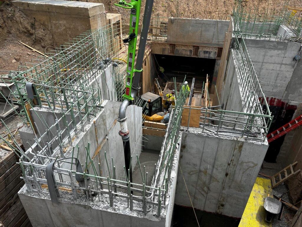 Flowable fill concrete has been placed inside the walls of the staircases and escalator.