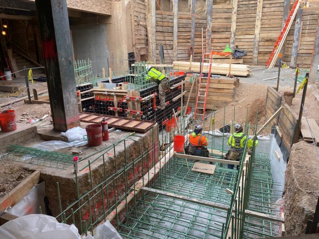 Escalator foundation and pit walls reinforcing steel and concrete have been installed.