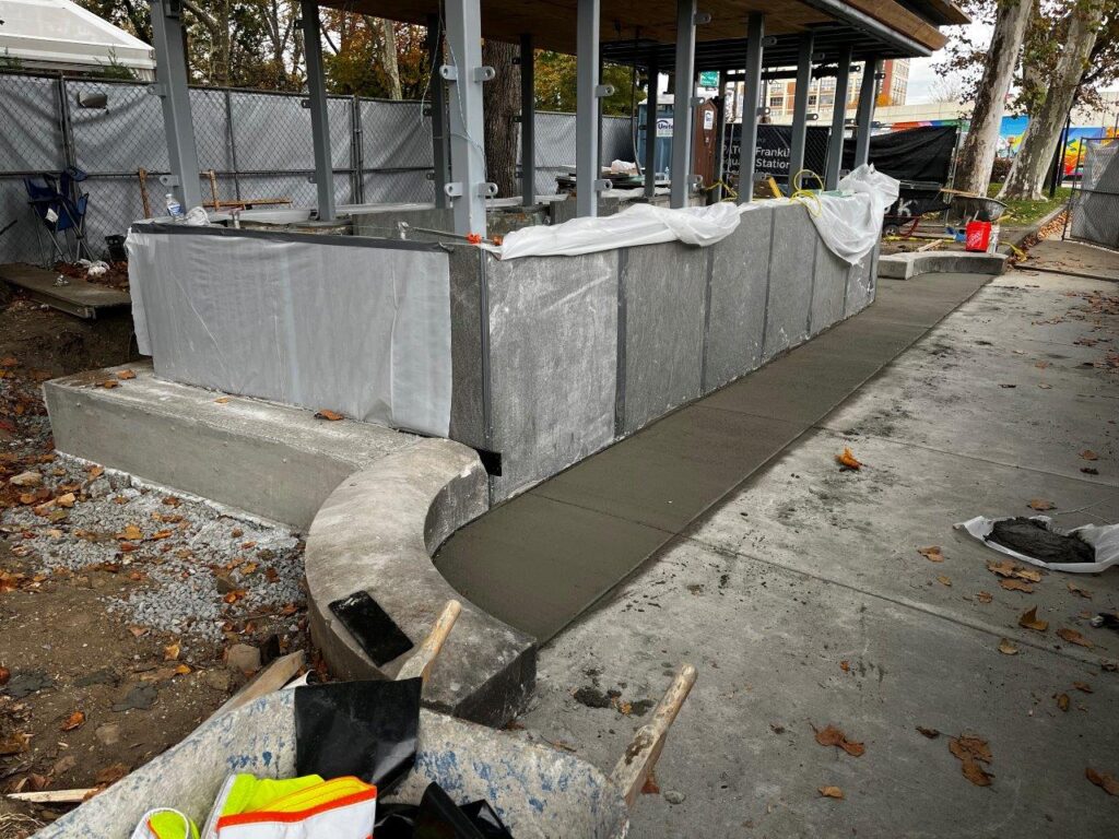 Concrete has been placed for the curbs and sidewalks at the 6th Street Emergency Egresses.