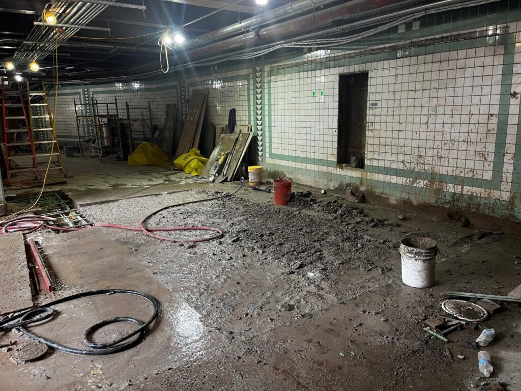 Selective demolition at the base of the new staircases and escalator has commenced, in advance of the installation of new floor tiling.